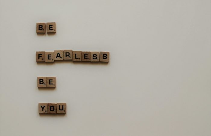 scrabble tiles forming be fearless be you phrase